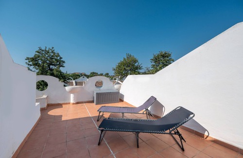 Urbanizacion Hacienda las Chapas House | Holiday Home 'Latifa' with Shared Pool, Wi-Fi and Air Conditioning