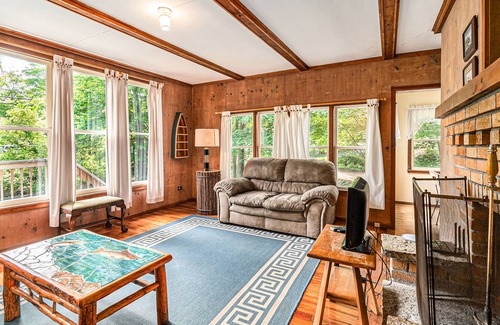 Frankfort Cottage | Homey cabin with lake access, firepit, yard games, kayaks, & basketball court