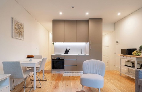 Guimaraes Apartment | HostWise - Sunny Flat w/Balcony