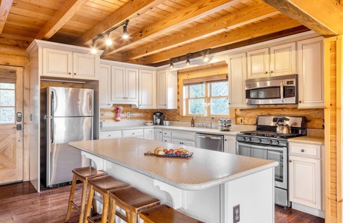 Asheville Cabin | Hot Tub, Fire Pit, Outdoor Dining | Cabin Mansion w/View | Leyland by AvantStay