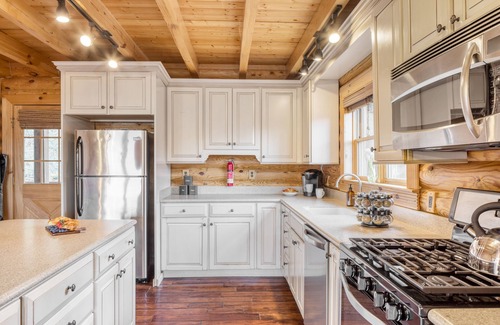 Asheville Cabin | Hot Tub, Fire Pit, Outdoor Dining | Cabin Mansion w/View | Leyland by AvantStay