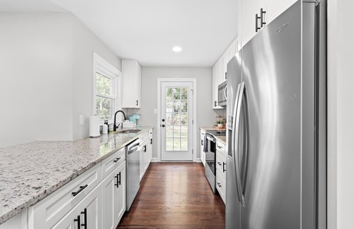 East Raleigh House | Hot Tub/Playground/Fire Pit/Backyard Retreat