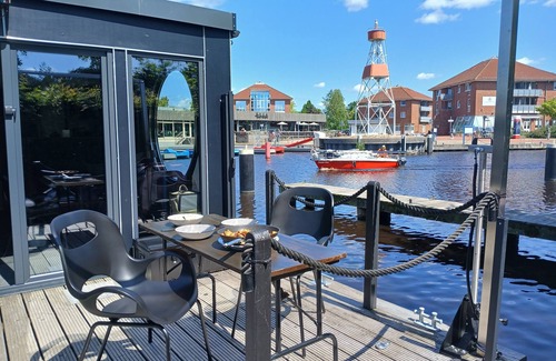 Center Boat Rental | Houseboat "Frodewin" experience on the water in Aurich harbor