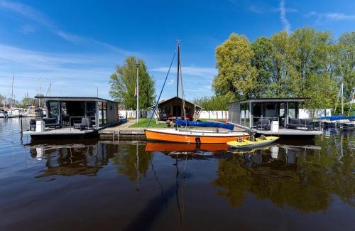 Heeg Boat Rental | Houseboat in Heeg with Stunning Marina Views