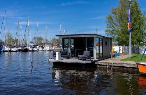 Heeg Boat Rental | Houseboat in Heeg with Stunning Marina Views