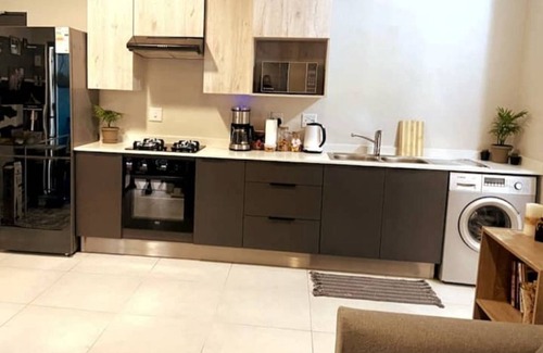 Greater Johannesburg Metropolitan Area Apartment | Icon Living at 93 on New Road Wi-Fi UPS