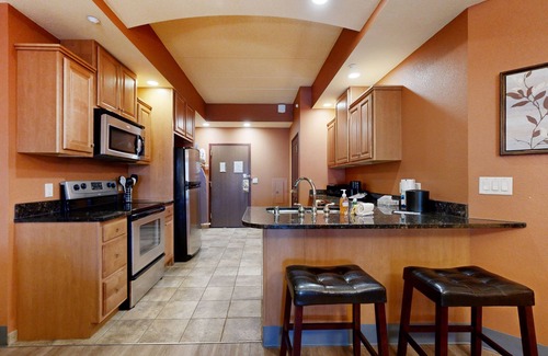 Lyndon Station Condo | Ideally located condo with fireplace, jetted tub, on-site golf, & central AC