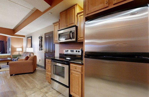 Lyndon Station Condo | Ideally located condo with fireplace, jetted tub, on-site golf, & central AC