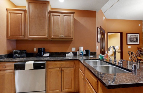 Lyndon Station Condo | Ideally located condo with fireplace, jetted tub, on-site golf, & central AC