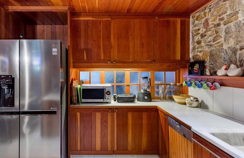 Daskalio Villa | Idyllic stone and wood villa with stunning, panoramic views of the Aegean Sea