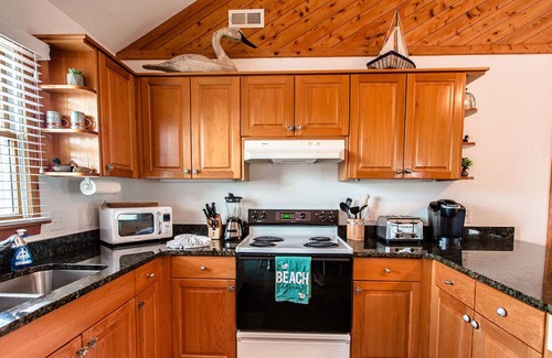 Carova Beach House | Immaculate Family-Friendly Canal Front Vacation Home in Outer Banks 4x4 Area