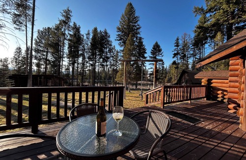 Seeley Lake Cabin | Immaculate log house with backyard view of pond, in Seeley!
