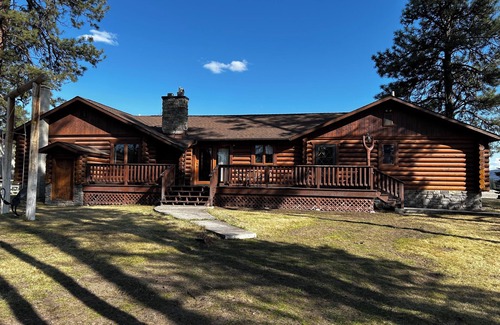Seeley Lake Cabin | Immaculate log house with backyard view of pond, in Seeley!