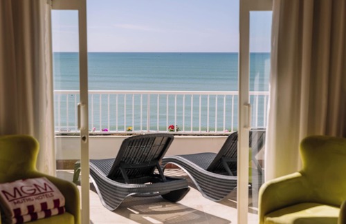 Oura Hotel | Indulge in Home-Like Comfort! Three Relaxing Suites, Pool, Beachfront Property!