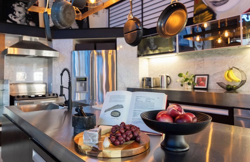 Historic Core House | Industrial-Chic DTLA Loft with Rooftop & City Views | Skyline Lofts by AvantStay