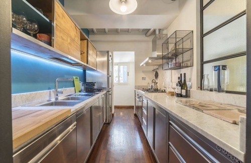 Rione III Colonna Apartment | Industrial Chic Loft Apartment in Historical Building
