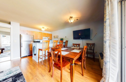Gilford Condo | Inviting condo in quiet locale with partial lake views, balcony & grilling area