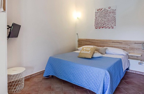 Sant'Angelo House | Inviting cottage with charming outdoor area and limited sea view.