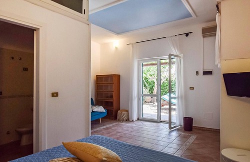 Sant'Angelo House | Inviting cottage with charming outdoor area and limited sea view.