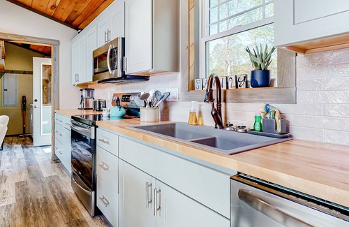 Marshall House | Inviting dog-friendly home with fitness area, firepit, central AC, & W/D