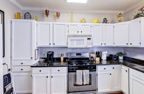 Midtown House | Inviting duplex with full kitchen, patio, central AC, & W/D