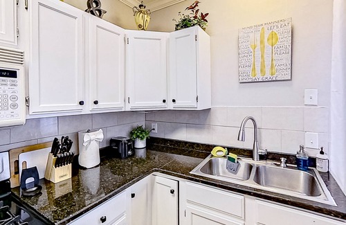 Midtown House | Inviting duplex with full kitchen, patio, central AC, & W/D