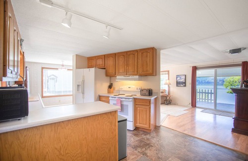 Harrison House | Inviting lakefront home with dock, fireplace, mountain view, & W/D