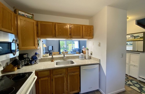 Brewster Condo | Inviting private patio, charming décor, and a wonderful location close to Pool, Tennis and Fitness.