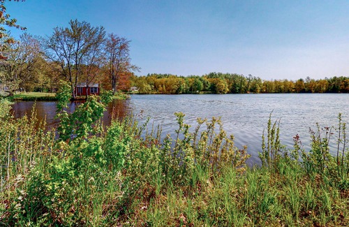 Barnstead House | Inviting riverfront home with pool, kayaks, firepit, & W/D