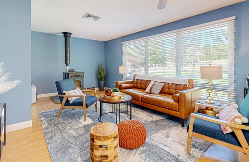 Barnstead House | Inviting riverfront home with pool, kayaks, firepit, & W/D