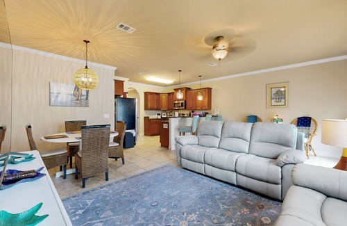 Navarre House | Inviting, two-story home with furnished patio, washer/dryer, & pool access