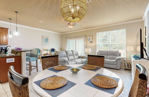 Navarre House | Inviting, two-story home with furnished patio, washer/dryer, & pool access