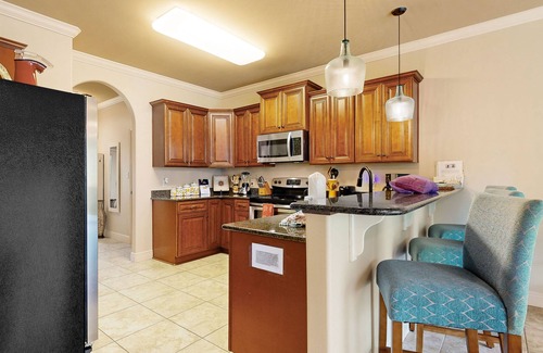 Navarre House | Inviting, two-story home with furnished patio, washer/dryer, & pool access