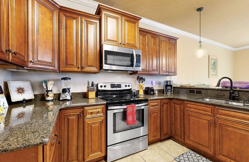 Navarre House | Inviting, two-story home with furnished patio, washer/dryer, & pool access