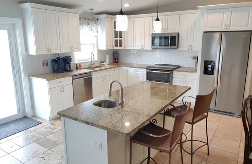 Butler Beach House | Island Escape - Water Views, Private Pool, Boat Dock, Walk to Beach