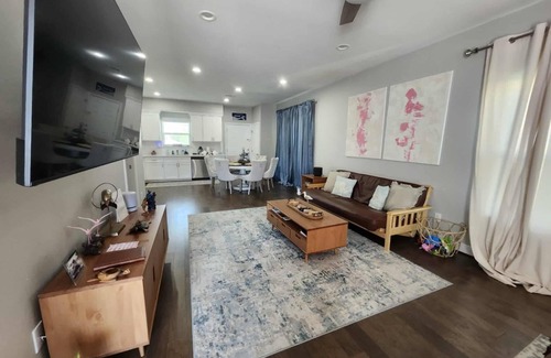 Galveston House | Island House two bedrooms two bath sleeping in the living room golf cart