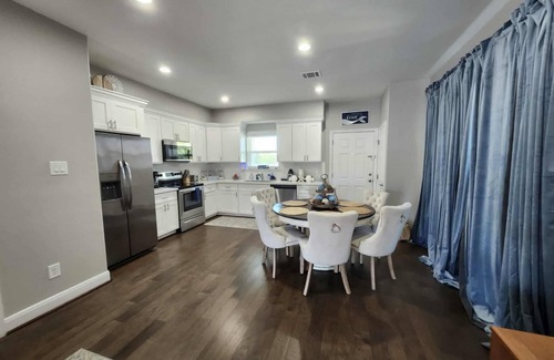 Galveston House | Island House two bedrooms two bath sleeping in the living room golf cart
