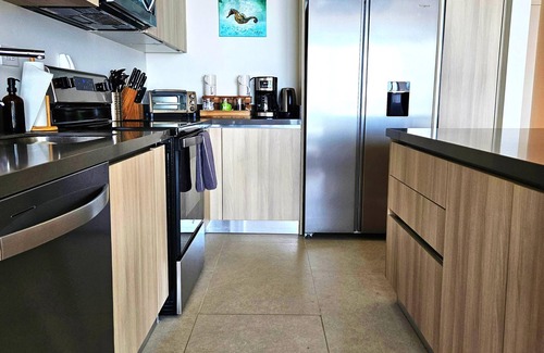 Jaco Condo | Jaco Beachfront Oasis 2-bedroom condo on Jaco Beach with AC, fitness room, WiFi