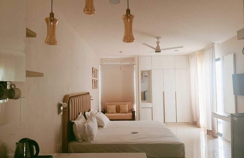 Vrindavan Apartment | Jigyasa Comfy Studio in Vrindavan near Bankebihari Prem Mandir AC Balcony kitchn