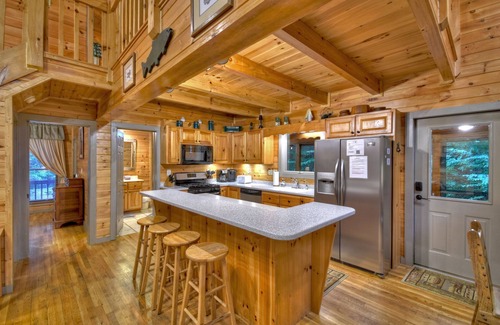 Cashes Valley Cabin | K6 Lodge - Gather around the firepit, soak in the hot tub, and splash in the creek!