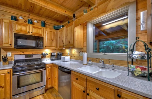 Cashes Valley Cabin | K6 Lodge - Gather around the firepit, soak in the hot tub, and splash in the creek!
