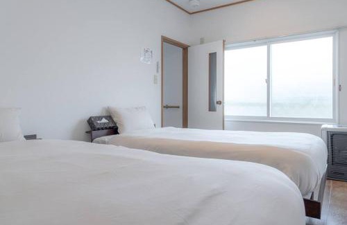 Motomachi Apartment | KAKUREGA by unito