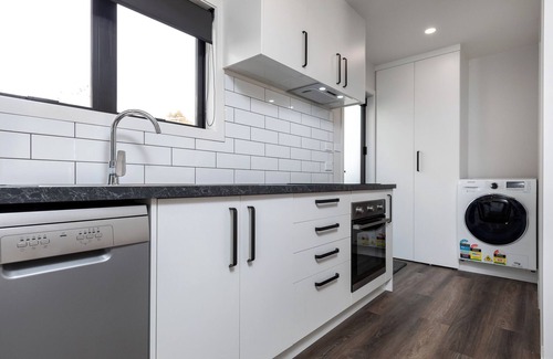 New Plymouth House | Kick back and relax in this calm, stylish space.