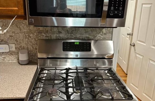 North Chicago Apartment | King Bed Private Backyard Grill and Fireplace