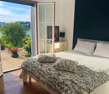 Bilieu House | L'EMERAUDE suite lake view swimming pool beach 10 min walk away