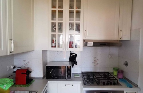 Quartiere XI Portuense Apartment | La Farfalla by Manu site in Marconi area, ideal for couples and business trips.