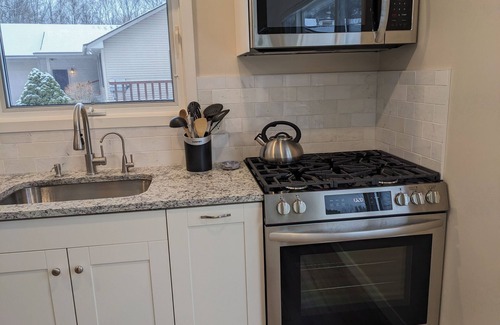 Lake Ann Cottage | Lake Ann, MI cozy waterfront cottage, newly remodeled with private beach & dock