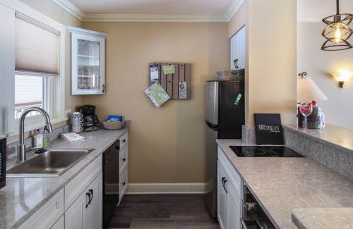Boyne City Condo | Lake Charlevoix Top-Floor Balcony Condo | Gas-Log Fireplace | Private Beach