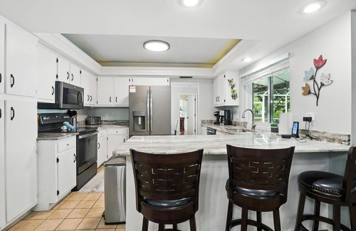 Fort Myers House | Lake Front Oasis in Cape Coral with Pool, Kayaks, and Scenic View