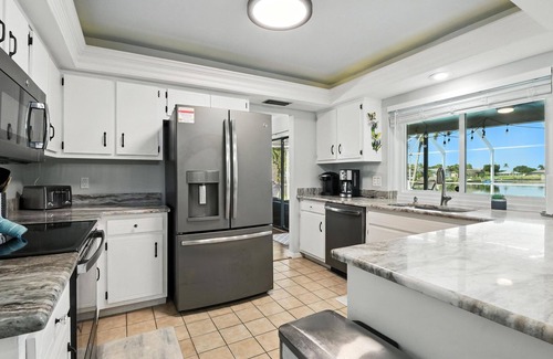 Fort Myers House | Lake Front Oasis in Cape Coral with Pool, Kayaks, and Scenic View